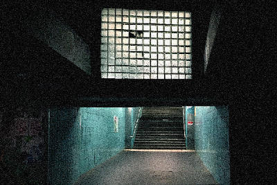 Image of a train station entrance at night